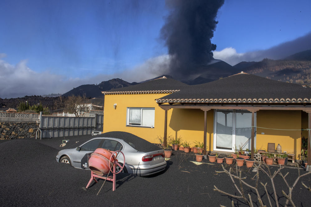خانه ای که در فوران آتشفشان غرق شد+عکس