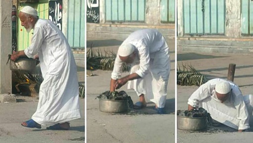 امام‌ جمعه گناوه در حال تمیز کردن ورودی فاضلاب +عکس